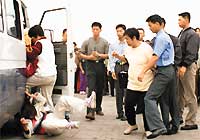 '这是我在天安门被推倒在地上的照片，照片登在明慧网10月2日的媒体新闻中。'