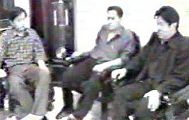 图5：二零零一年五月十一日夜恶徒靖军（左）与任广民（中）、韩洪光（右）研究夜审迫害计划（资料照片来源：