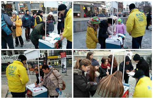 图：罗马尼亚法轮功学员在首都市中心传播真相，了解真相的人们纷纷在“制止中共强摘法轮功学员器官”请愿书上签名。