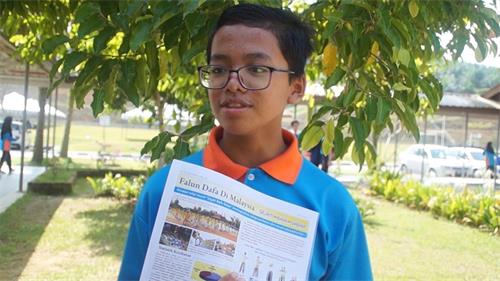 '图15：学生Muhammad Nur Syamil炼了法轮功心情好转。'