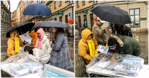 '图3：明白了真相的瑞典民众，冒雨用自己的签名来表达支持法轮功学员反迫害'