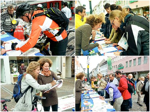 图1-3：在德国名城弗莱堡繁华的市中心的法办江泽民的请愿征签桌前，德国民众经常排队或几个人同时签名，表达他们的支持