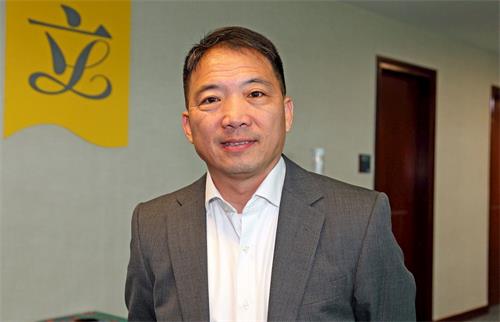 '图8：香港立法会议员、民主党主席胡志伟'