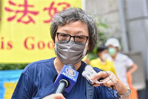 '图3：香港法轮功发言人刘惠卿呼吁各国政府及各界民众制止中共迫害法轮功，解体中共。'