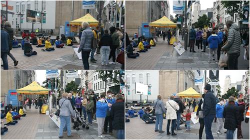 '图1～2：法轮功学员在比利时安特卫普市商场林立的梅尔大街上举办讲<span class='voca' kid='62'>真相</span>活动。'