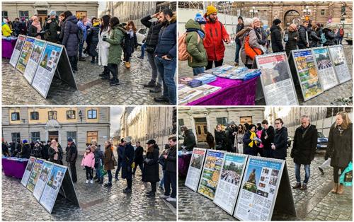 '图1：二零二零年二月二十九日，瑞典法轮功学员在斯德哥尔摩钱币广场设立真相点。真相展板吸引过往路人驻足观看、仔细阅读。'