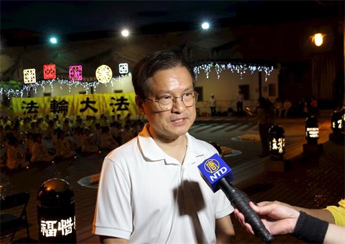 '图8：前彰化县县长魏明谷参加法轮功反迫害二十一周年烛光悼念活动。'