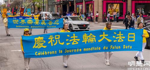 '图2～11：5月8日，加拿大魁北克部份法轮功学员在蒙特利尔举行盛大游行活动，庆祝世界法轮大法日。'
