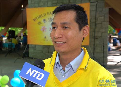 '图6：越南裔法轮功学员Michael Mai说修炼后他与太太的关系更加和睦。'